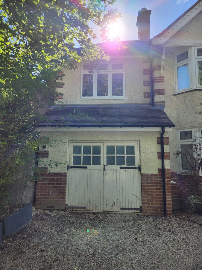 Rendered front elevation with garage doors