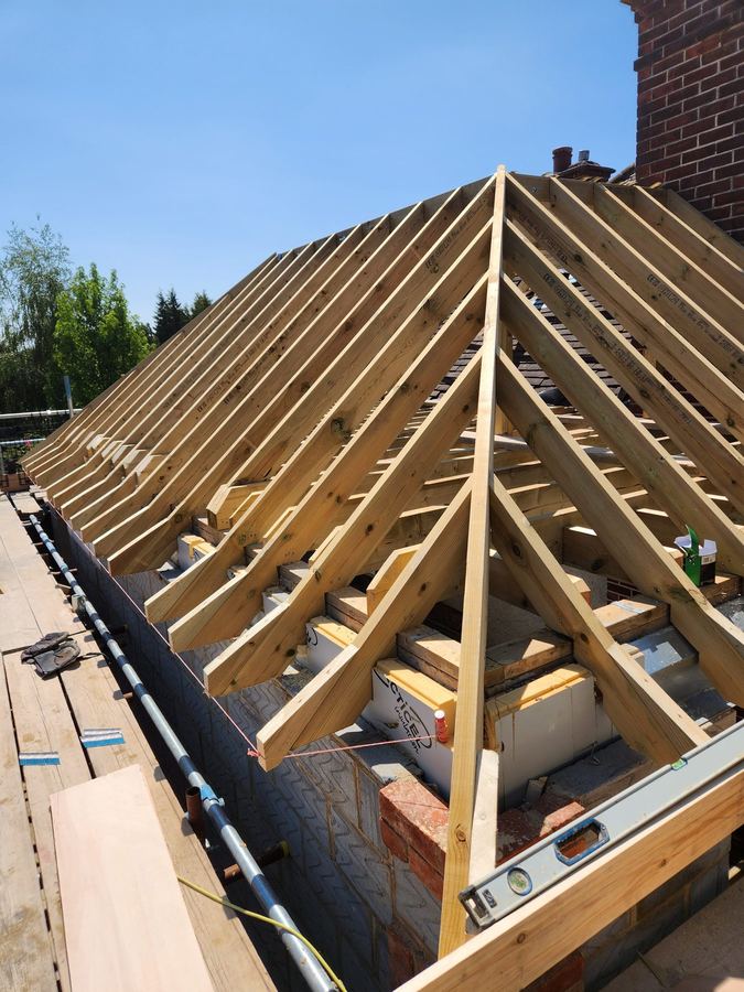 Cut roof carpentry with rafters and insulation during construction
