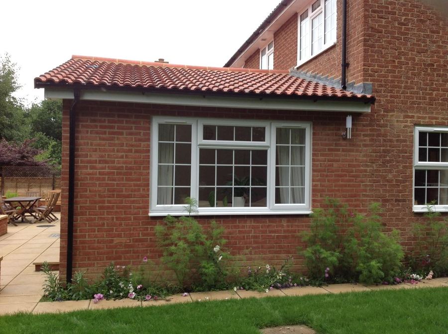 Single storey side extension with a bay window and clay pantile roof